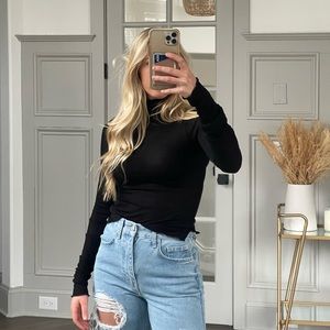 Free people black title neck. Size XS.